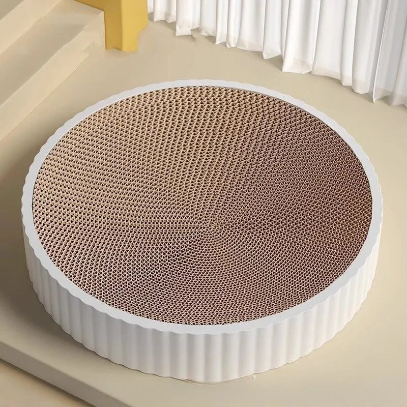 Round green or white cat scratching board nest with replaceable corrugated cardboard centre, 55 cm diameter.