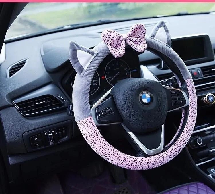 Cute cat ear steering wheel cover in short plush cashmere wool, black colour, on a steering wheel