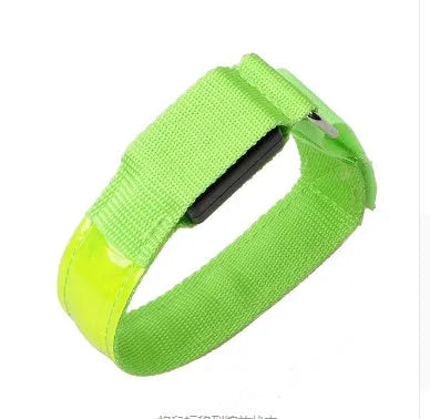 Illuminated arm band with LED lights on a black ribbon, adjustable, showing blue and red colours
