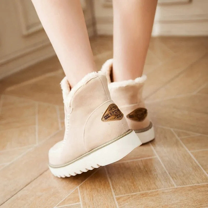 Women's winter snow boots in black with plush flannel lining, rubber sole, mid heel, round toe, ankle-high.