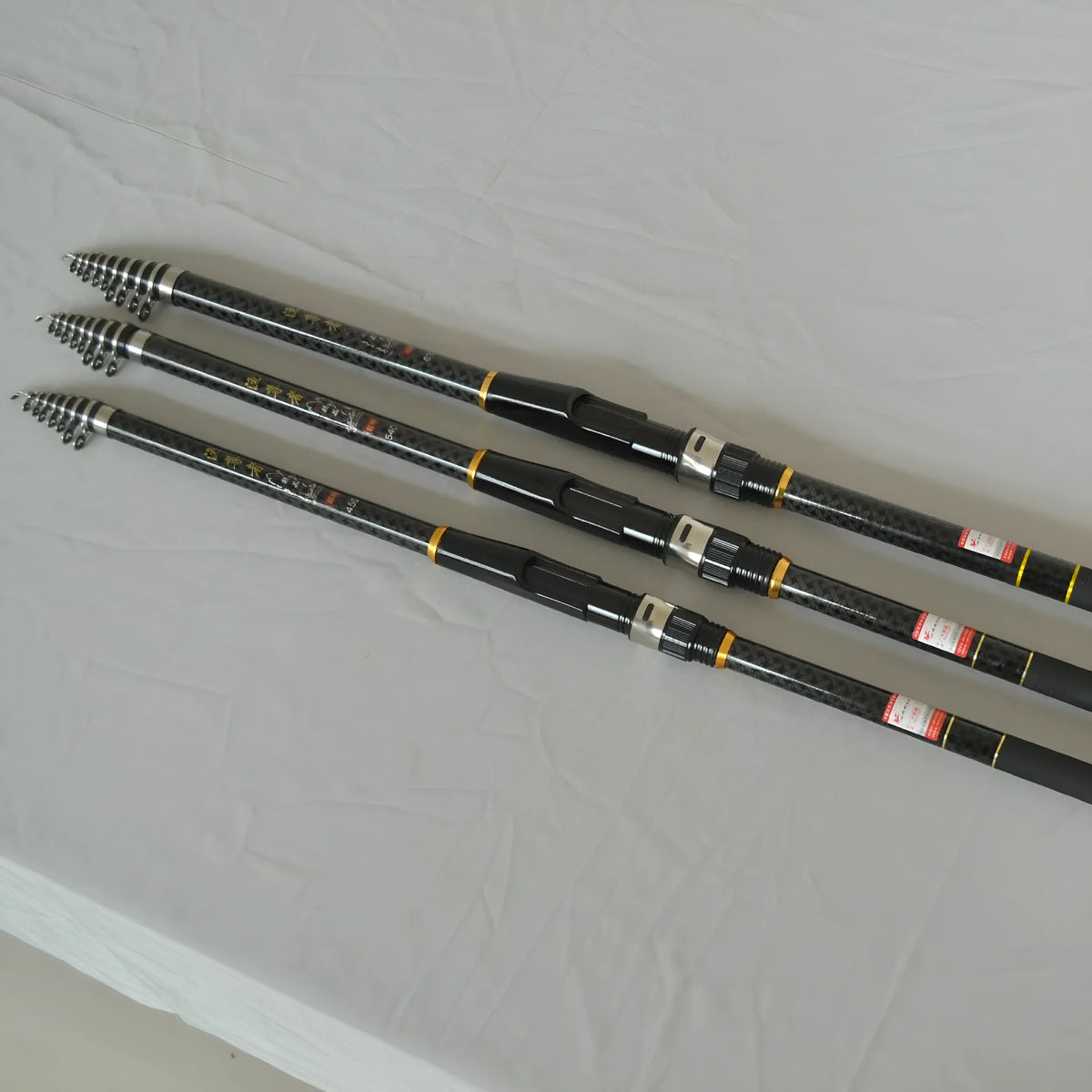 Carbon fibre telescopic fishing rod with four adjustable lengths for saltwater and freshwater rock fishing