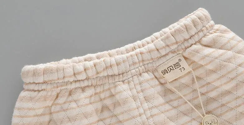 Infant warmer suit in cotton with cartoon stripe pattern and buckle closure in buckle camel colour