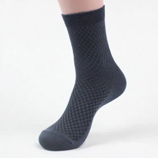 Pack of five men's bamboo fibre ankle socks in different colours, showing small square pattern.
