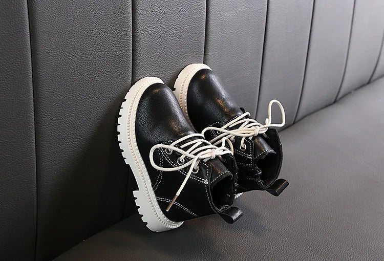 Boys leather short boots with synthetic upper and rubber sole in beige colour, side view