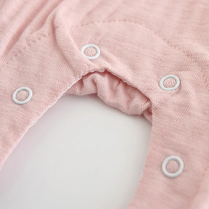 Pink cotton baby girl embroidered jumpsuit with long sleeves and single-breasted closure