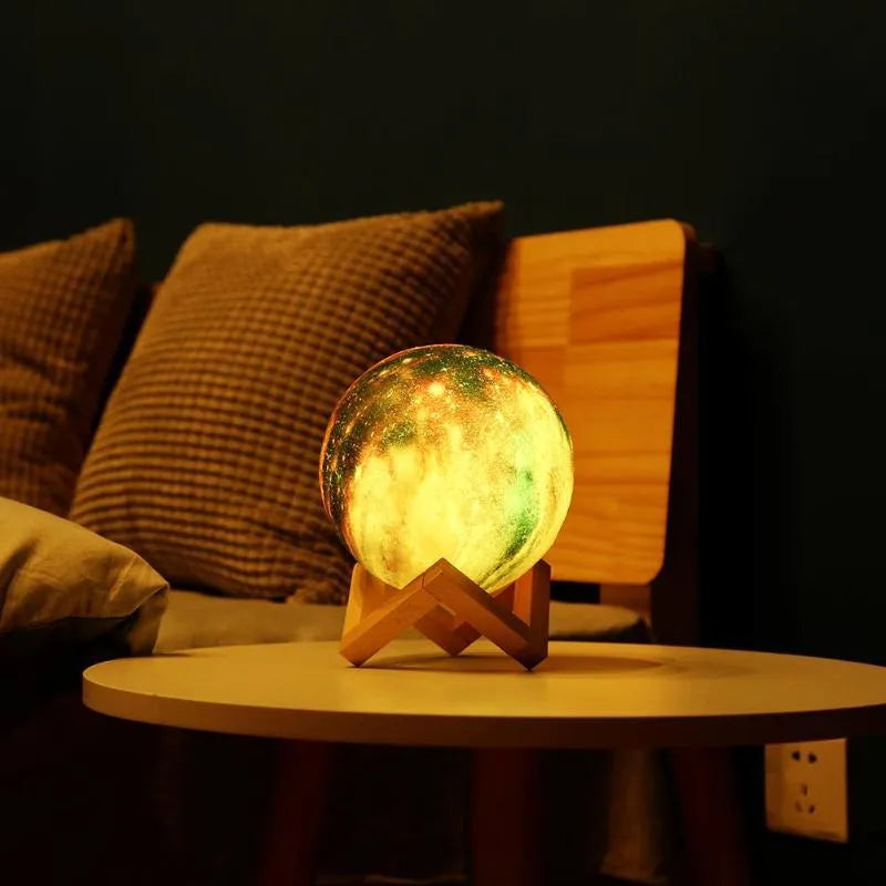 3D printed spherical lunar night light on a table, demonstrating remote control and colour-changing LED effects.