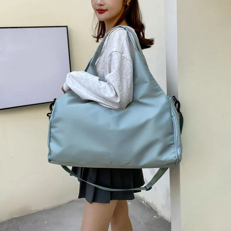 Women's large capacity Oxford cloth yoga bag with dry and wet separation in grey, shown with a yoga mat and laptop inside