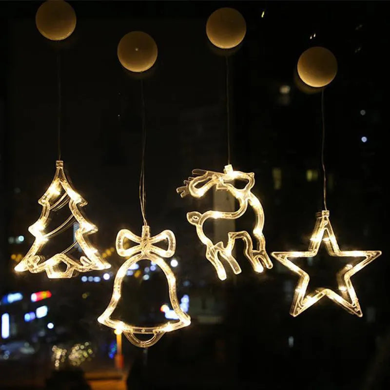 Battery powered LED decorative light with suction cups showing Santa Claus and snowman designs on a window.
