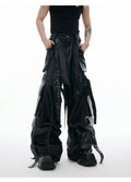 Black loose-fit multi-pocket trousers with quilted stitch detailing on a mannequin.