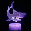 3D shark-shaped LED table lamp with touch-sensitive base and remote control showing blue illumination