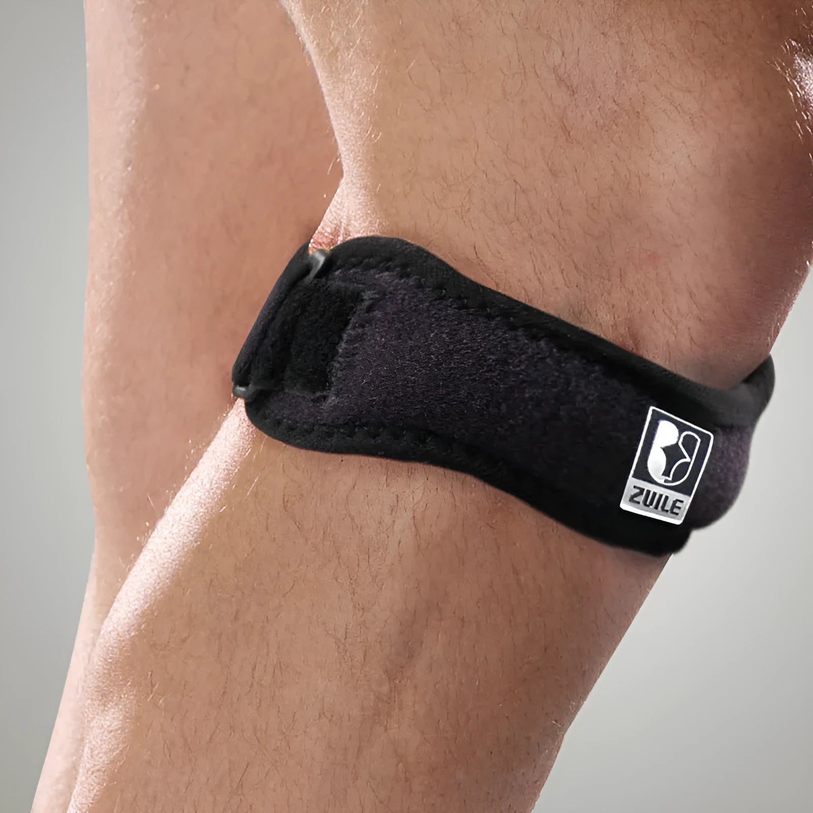 Black adjustable patella support band with sponge pad and plastic buckle for adults