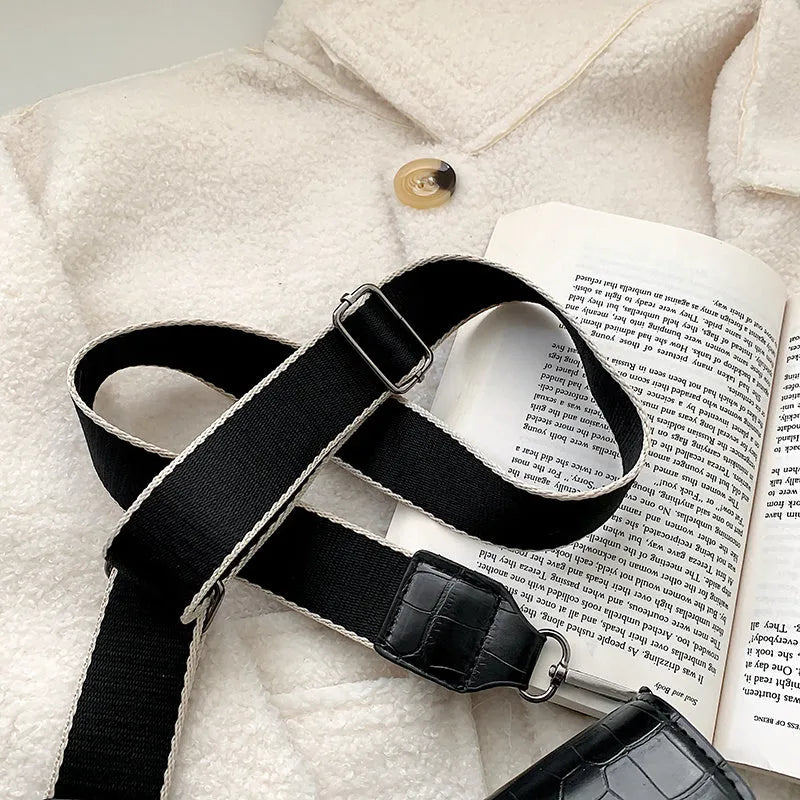 Vintage PU leather crossbody bag shown in black, dimensions 20cm by 14cm.