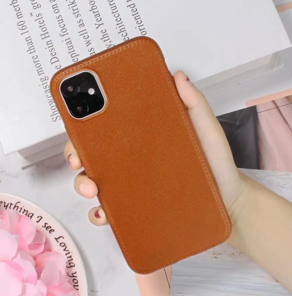 Genuine leather iPhone case with TPU interior in black, brown, navy blue, and wine red colours