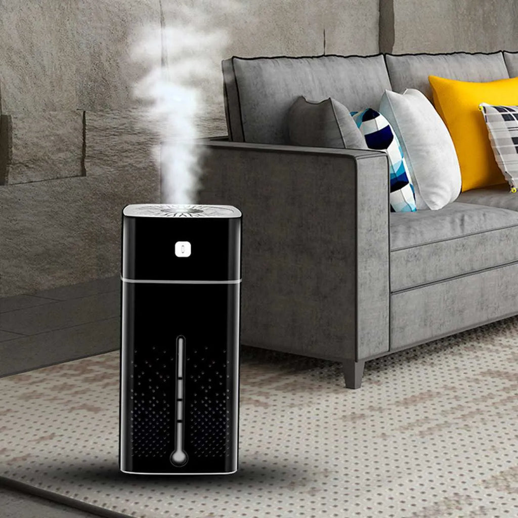 A compact black or white desktop humidifier with USB cable, standing 218mm tall on a wooden desk.