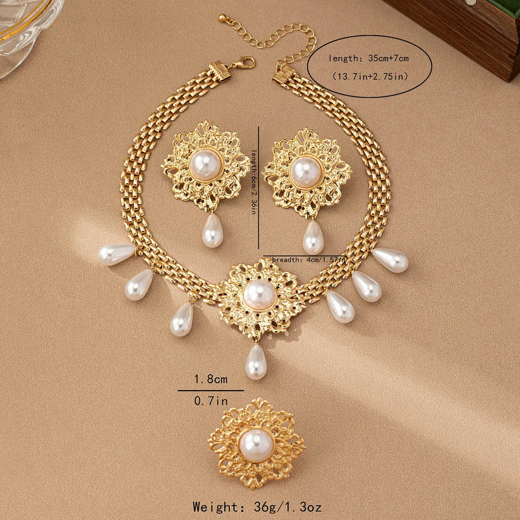 French retro hollow flower pearl tassel jewellery set in white, including necklace, earrings, and ring, alloy material