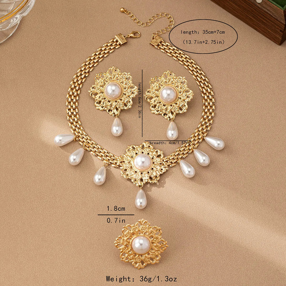 French retro hollow flower pearl tassel jewellery set in white, including necklace, earrings, and ring, alloy material