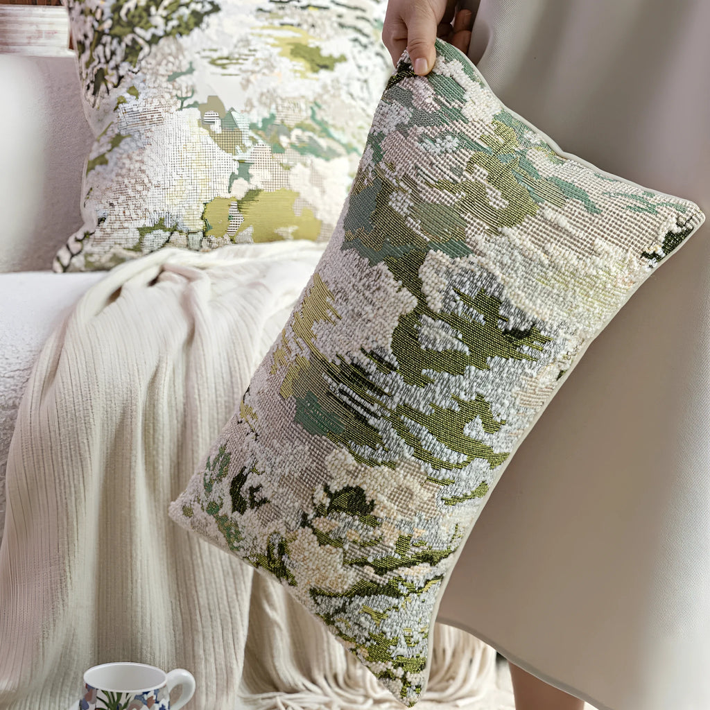 Antique green wool blend cushion with abstract spring flowers pattern in square and rectangular sizes.