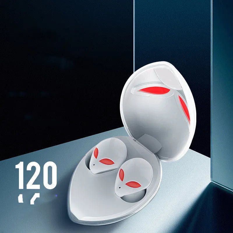 Creative Outer T8 Starman alien design Bluetooth earbuds with LED lights next to wireless charging case.