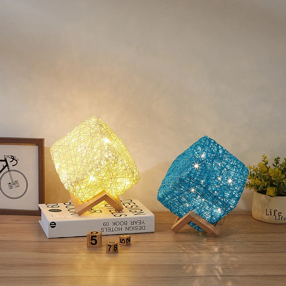 Hand-knit square LED desk lamp with bamboo rattan twine in beige, USB charging, on a wooden desk