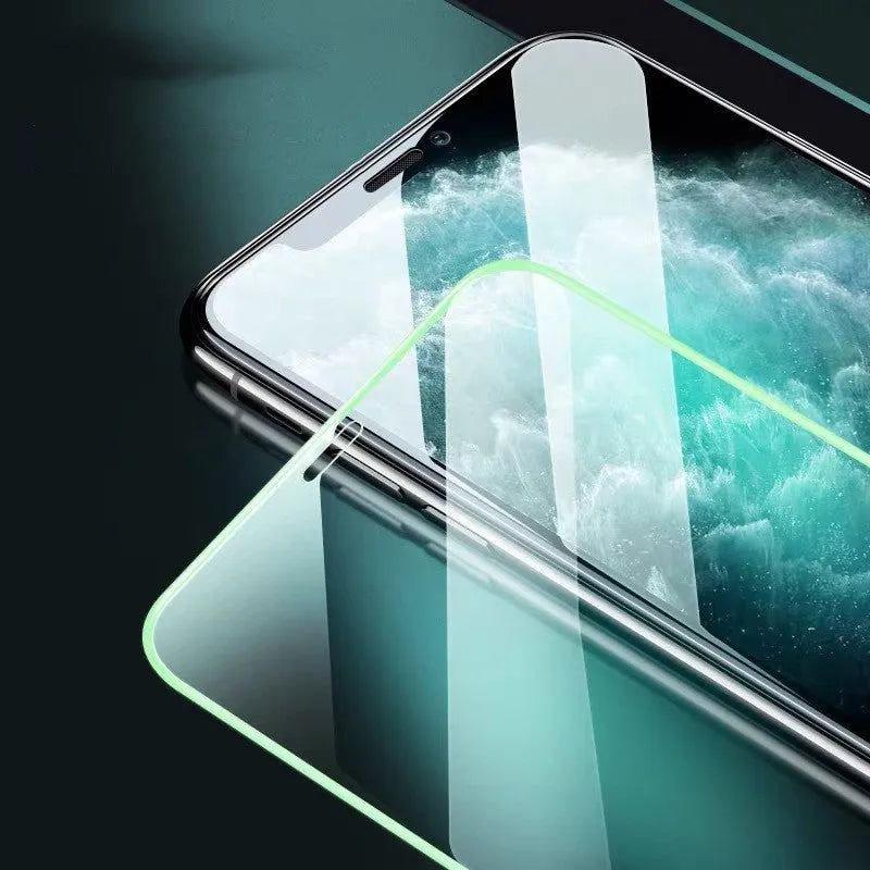 Luminous full cover tempered glass screen protector glowing in the dark for iPhone.