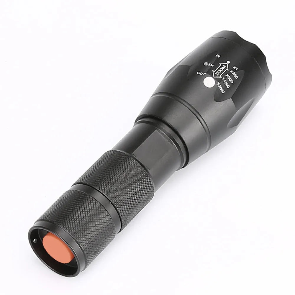Black aluminium zoomable LED flashlight with adjustable focus ring and anti-skid body.