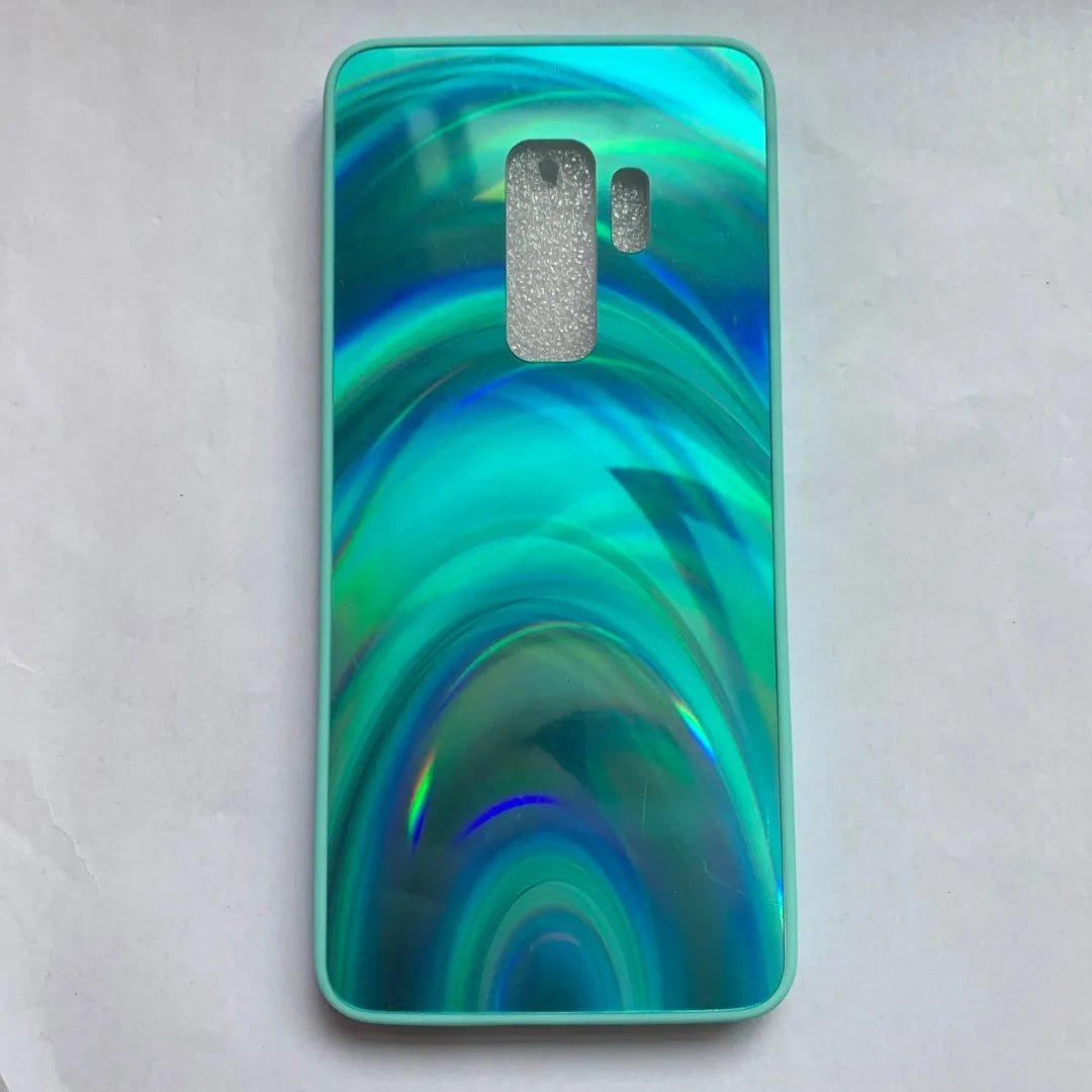 A 3D rainbow glitter gradient back cover case for a smartphone, showing its full-coverage design and sparkling finish.