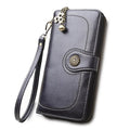 Split leather long wallet for women in black, folded with zip closure and multiple card slots visible