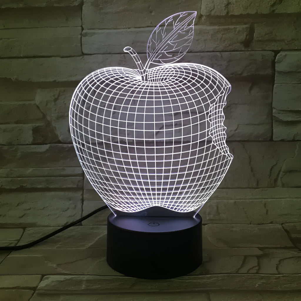 Colour-changing fruit-shaped acrylic night light with touch control on a surface.