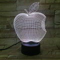 Colour-changing fruit-shaped acrylic night light with touch control on a surface.