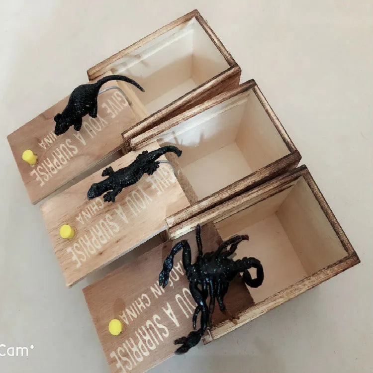 Wooden prank box with jumping scorpion, gecko or mouse for April Fools jokes