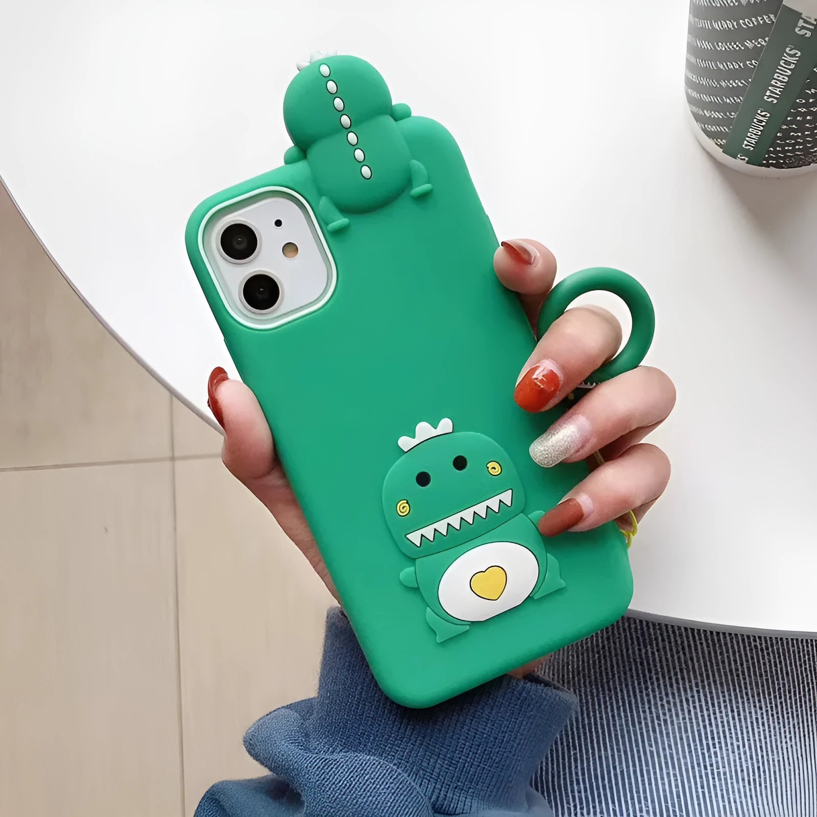 Green silicone iPhone case with cartoon animal design showing back and side protection