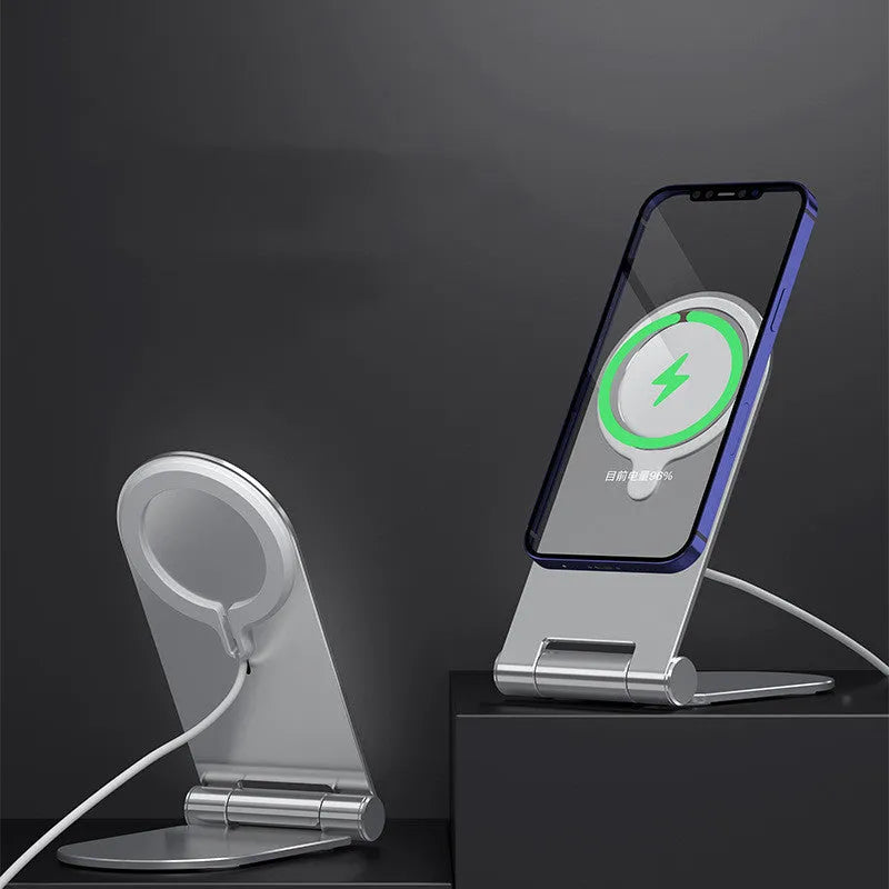 Silver vertical adjustable magnetic phone mounting bracket for iPhone12 on a desk.