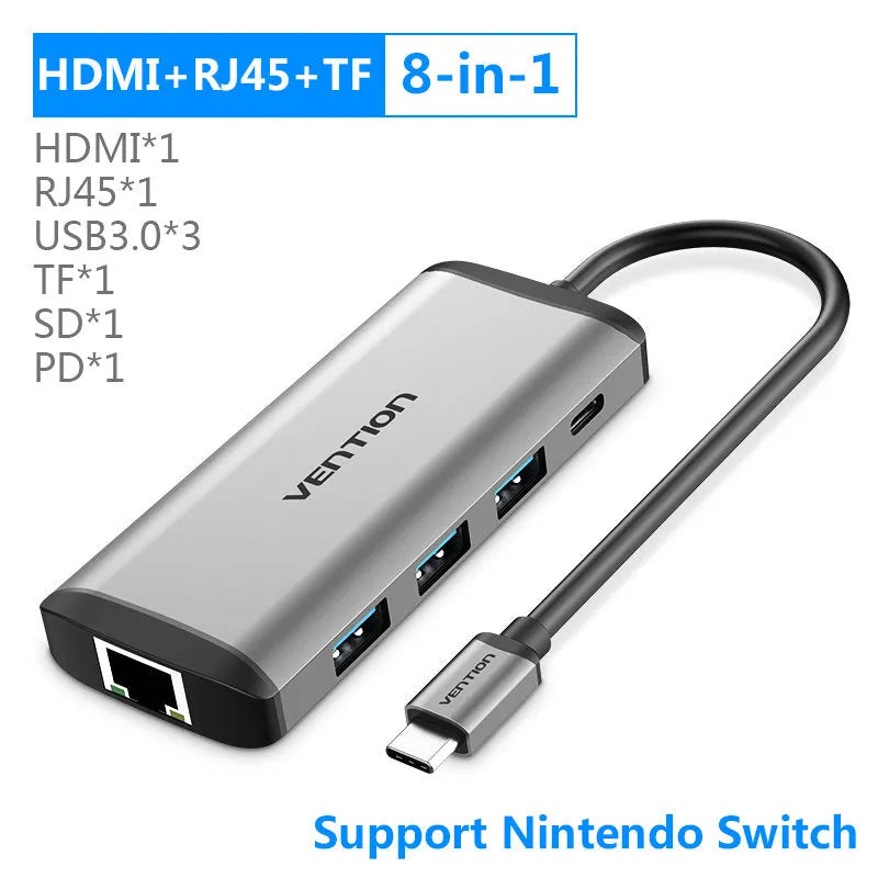 Deep grey aluminium USB-C to HDMI, USB 3.0, Ethernet, and PD charging 6-in-1 hub adapter.