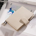 A6 leather notebook with lychee pattern cowhide cover showing loose-leaf binding in three colour options