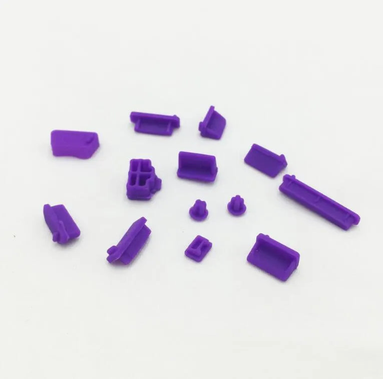 13-piece silicone dust plug set for laptop ports in multiple colours including transparent and black
