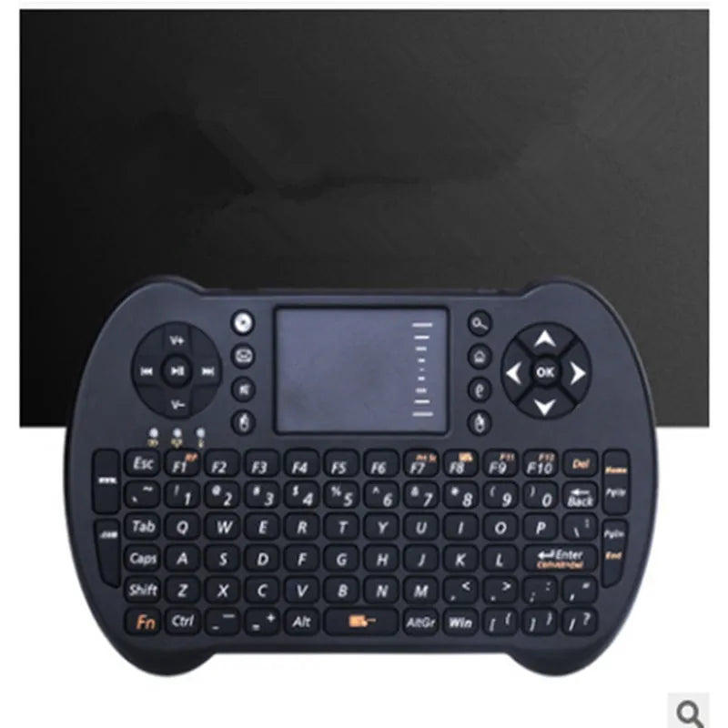 Black wireless QWERTY keyboard air mouse combo with touchpad, 146.8x97.5x19mm, on a table