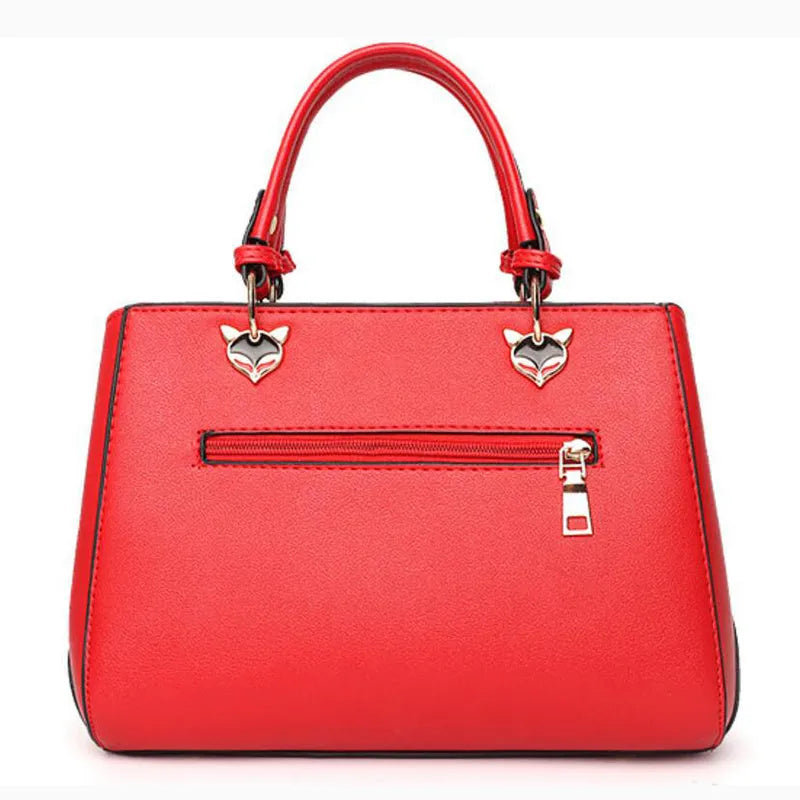 Women handbag made of PU leather with patchwork design and hairball ornaments in grey, pink, purple, and red colour options
