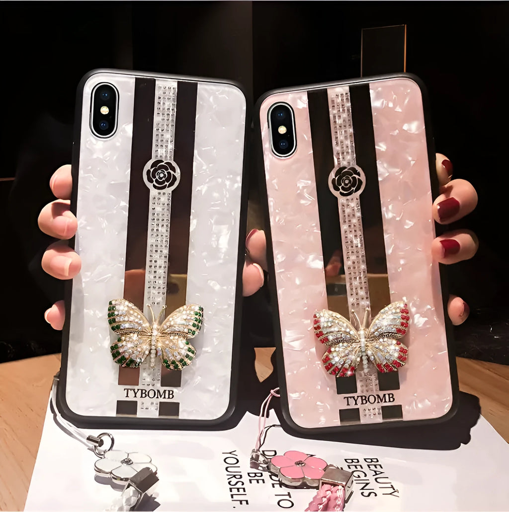 Clear acrylic iPhone case with a sparkling butterfly design and a reflective mirror surface.