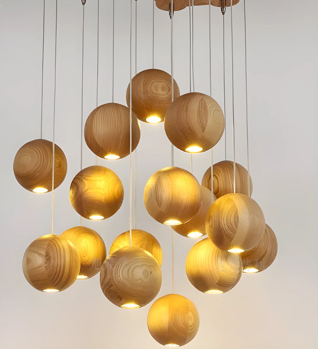 Nordic style solid wood ball chandelier hanging from ceiling with adjustable cord.