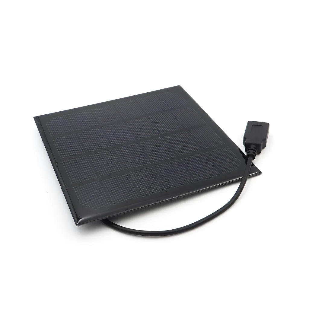 Portable solar panel unit with a small fan and a USB charging port for mobile phones.