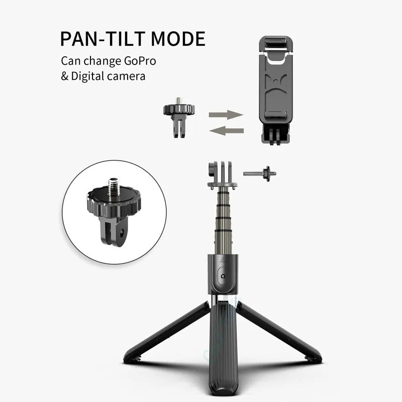 Black aluminium iPhone tripod selfie stick extended to 700mm on a table.