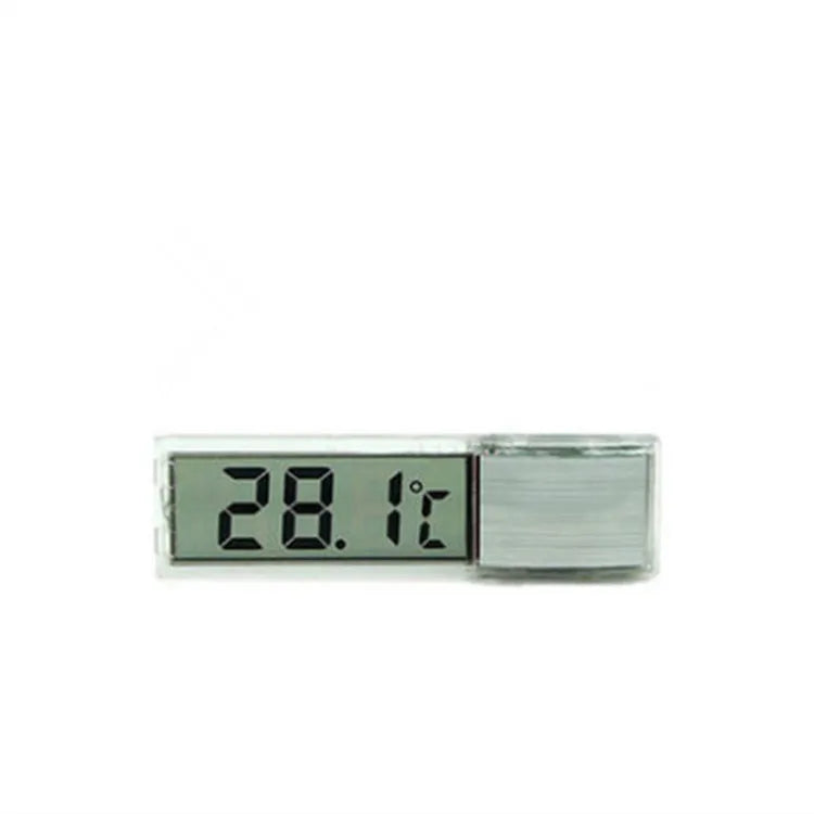 Gold digital stick-on aquarium thermometer on glass tank showing temperature reading