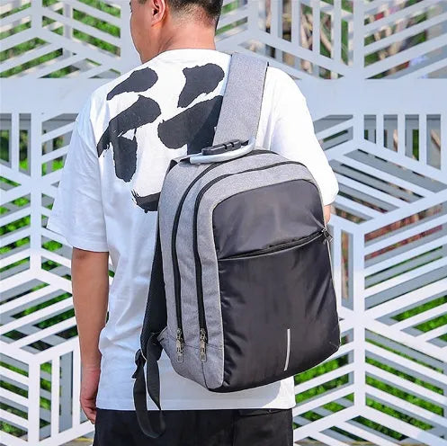 USB charge anti theft backpack in black polyester with zipper closure, 43x26x13cm, fits MacBook Air and iPad