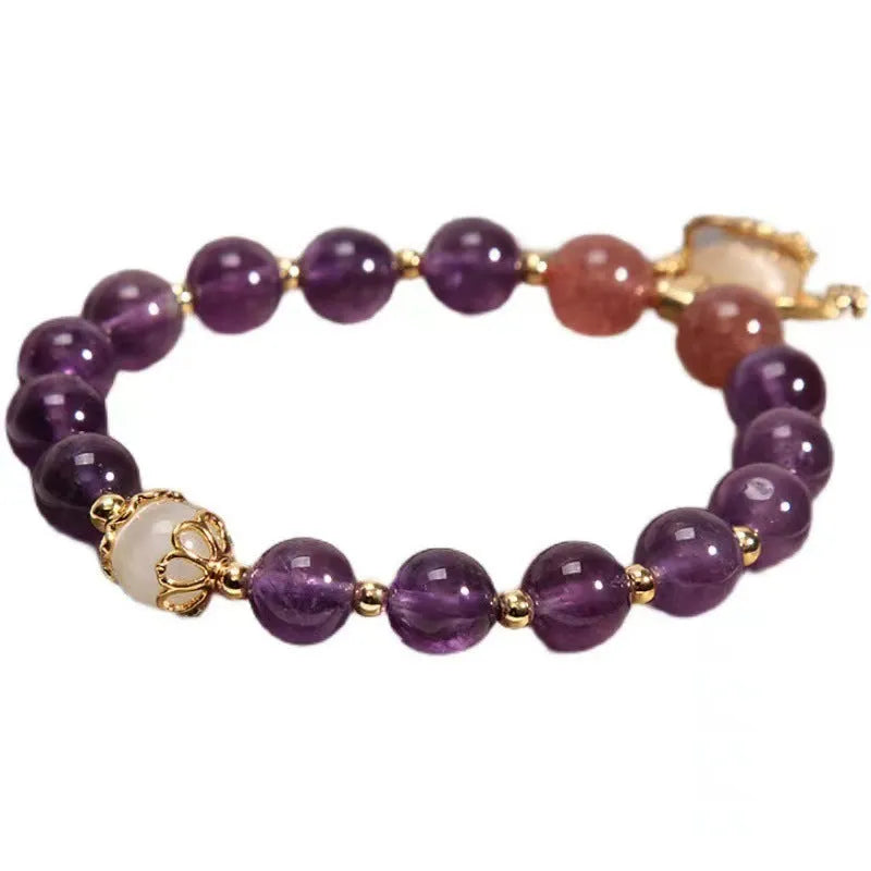 Handmade copper women's bracelet with a drop-shaped longevity lock charm and natural amethyst stones.
