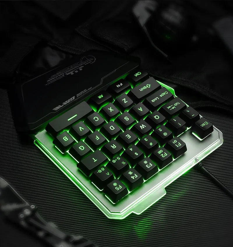 G40 Flow black one-handed mechanical keyboard with RGB backlit keys on a desk