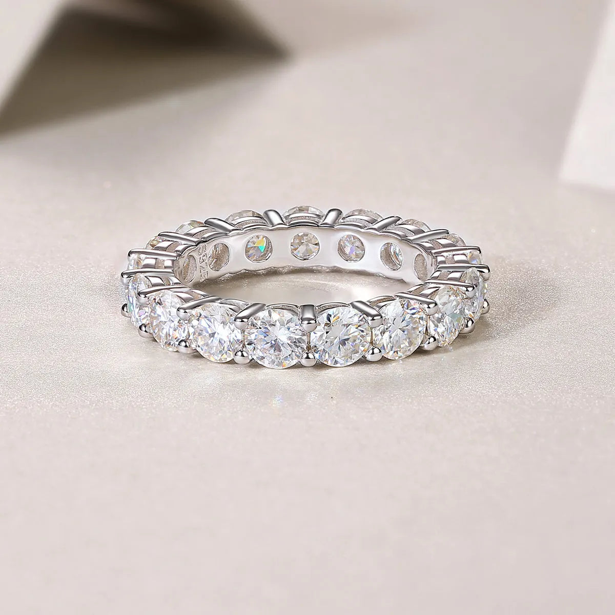 Starlight moissanite wedding ring set in S925 silver platinum plated on display in gift box, available in yellow gold and rose gold