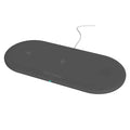Black three-in-one wireless charging station for Apple Watch, iPhone, and headphones on a desk.