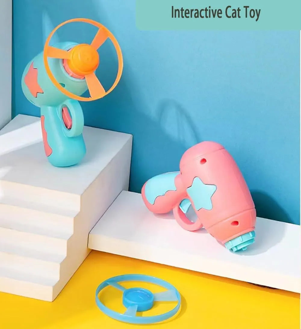 Blue plastic cat toy gun with spinning disc launcher for indoor feline entertainment