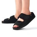 Wide adjustable foam bottom slippers with mesh upper in black, side view