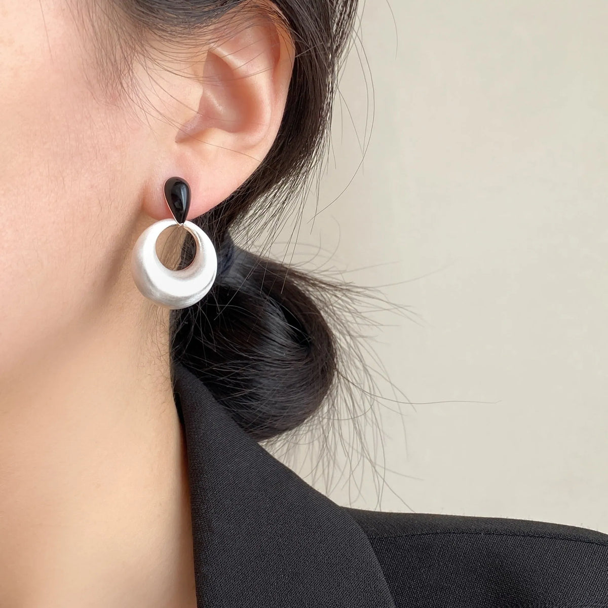 Retro geometric drop earrings with oil drop colour clash, copper, shown as ear clip or ear stud pair.